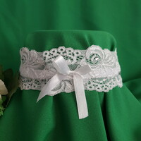 Bridal garter with rhinestones, snow-white lace, white bow, thigh lace