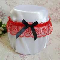 Bridal garter with red lace, black bow, thigh lace