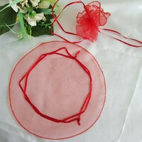 New, circular, shiny red organza decorative bag, gift bag