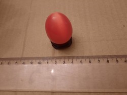 Carnelian mineral egg on a wooden base, negotiable