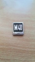 Olivetti M40   jelvény, kitűző ??