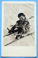 Antique New Year greeting photo postcard - laughing little child who fell down while skiing