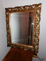 Mirror in a gilded, carved wooden frame