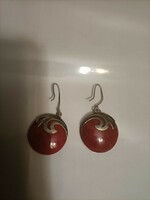 Silver earrings with a red stone