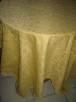 Beautiful golden yellow damask tablecloth with a rich flower and Toledo pattern with a lace edge