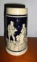 Beer mug with German embossed pattern. 13 cm high.