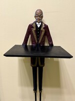 Antique restaurant waiter made of metal, figure holding an ashtray