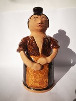 Female figural glazed ceramic bottle