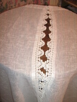 A pair of beautiful vintage hand-crocheted woven stained-glass curtains with a lace edge