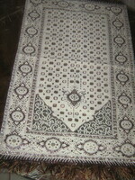 Cute fringed, silvery, woven tablecloth