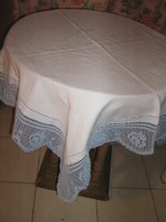 Beautiful handmade crocheted rosy tablecloth with a lacy edge
