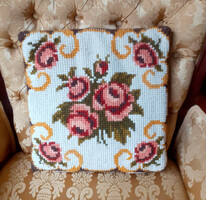 Pink tapestry decorative pillow with filling.