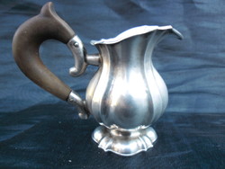 Antique, silver, marked, spout. With ebony lugs, marked on the bottom. Flawless collector's item.