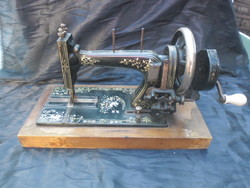 Antique, rare mustel sewing machine, around the turn of the century, attached to a wooden board, made in Germany, works!