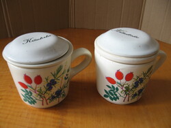 A pair of mugs with herbs and wildflowers, a pair of waechtersbach ceramic filter mugs with a lid