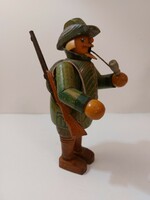 Smoking wooden figure with a hunting rifle 19 cm