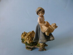 Resin statue of a little girl with a basket