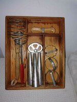 Old kitchen utensils in wooden storage
