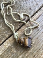 Old oriental carved tiger eye mineral pendant on cord necklace