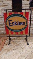 Retro eskimo ice cream advertisement with stand