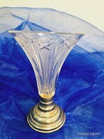 Old engraved polished glass vase with metal base