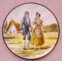 A wall plate with a Catalan romantic scene, an exquisitely painted handcrafted piece