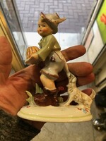 German porcelain statue of a little boy with a bowler hat, with a dog, 12 cm in size.