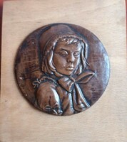 Little girl ceramic wall picture on a wooden base