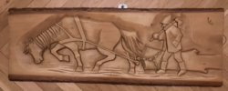 Carved Transylvanian mural, a horse pulling a log and the woodcutter, marked