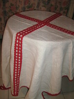 Woven tablecloth decorated with beautiful antique white red crochet lace