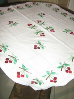 Beautiful cross-eyed cherries on a white tablecloth