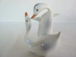 Couple of raven porcelain geese