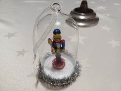 Nutcracker figure Christmas tree decoration that can be hung under a glass hood