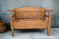 Folk-style wooden bench seat with storage