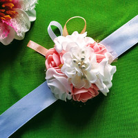 Wedding csd03 - bracelet made of peach and white foam flowers with a white flower in the middle