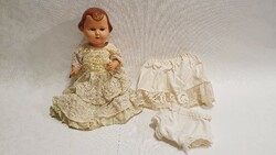 Old, marked doll, damaged for sale.
