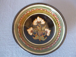 Ceramic wall plate.