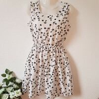 New M sleeveless summer dress, mini dress with a star and anchor pattern on a white background