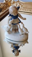 Old German porcelain. Little girl with geese.