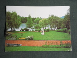 Postcard, lake for boating in a forest, park detail, spatial plastic sculpture