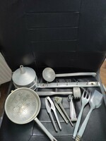 Peaceful-retro aluminum kitchen utensils mixed in one.