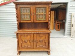 The colonial sideboard shown in the pictures is for sale.