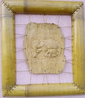Exotic Far Eastern handicraft. Leatherette relief with a bamboo frame. It's elephantine