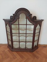 A wall display case with a baroque atmosphere