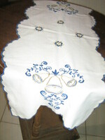 Beautiful hand-embroidered Christmas tablecloth runner with a slinged edge