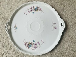A giant porcelain cake serving bowl with a handle