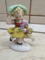 Little girl in a green hat with a toy statue! Antique porcelain statue, marked and numbered at the bottom for sale!