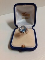 A marked silver ring in good condition set with a polished aquamarine stone