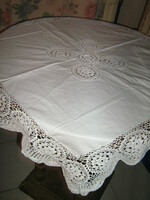 Beautiful hand-crocheted snow-white elegant needlework tablecloth