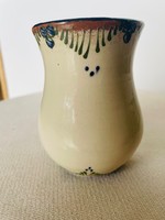 Bright glazed ceramic small vase with a folk motif
